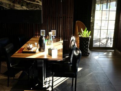 Sunlight streaming through a window onto a wooden floor.
